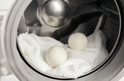 white towel and two eggs inside the dryer