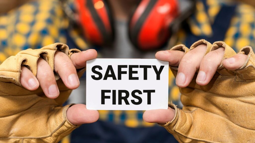 woman holding a safety first sign