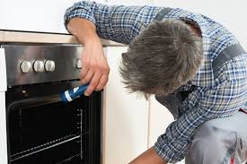 man checking the oven